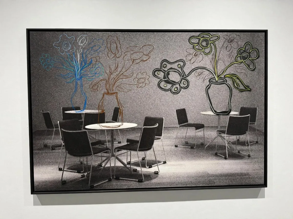 Untitled (room with vases): a black-and-white room of round tables where vases and flowers rise, drawn in coloured line